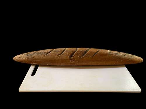 A Carved Bakers Window Display Of A French Baguette