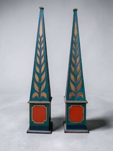A DECORATIVE PAIR OF POLYCHROME PAINTED OBELISKS