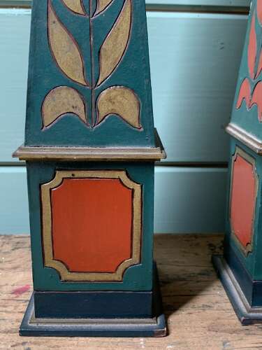 A DECORATIVE PAIR OF POLYCHROME PAINTED OBELISKS