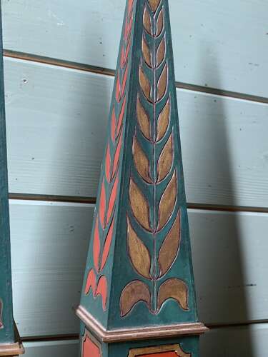 A DECORATIVE PAIR OF POLYCHROME PAINTED OBELISKS