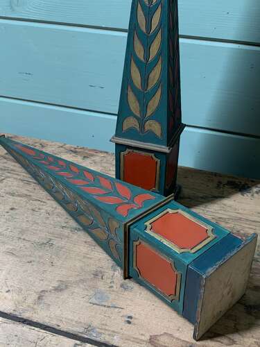 A DECORATIVE PAIR OF POLYCHROME PAINTED OBELISKS