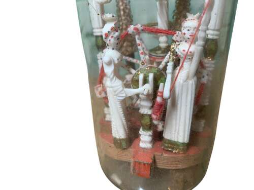 A RARE P.O.W BOTTLE WHIMSEY WITH CARVED AFRICAN FINIAL