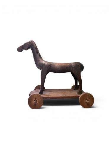 ANTIQUE NAIVE CARVED FIGURE OF A TOY HORSE