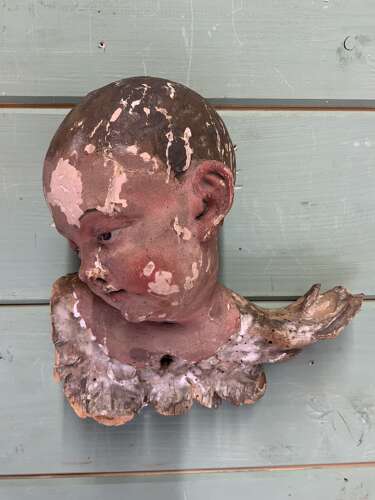 AN EARLY 18th C FRENCH CARVING OF A PUTTO