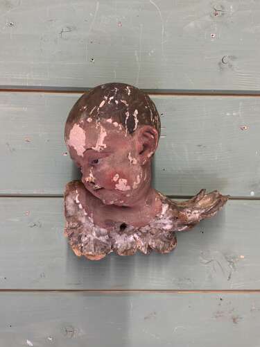 AN EARLY 18th C FRENCH CARVING OF A PUTTO