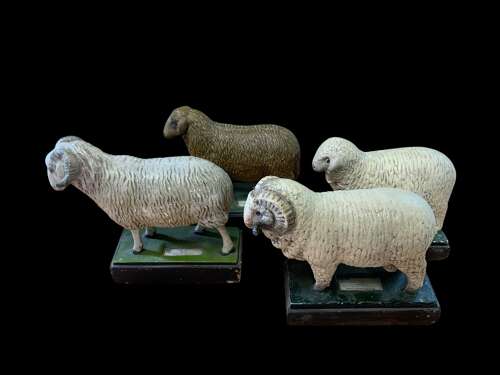 A MID CENTURY COLLECTION OF PLASTER SHEEP MODELS