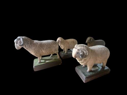 A MID CENTURY COLLECTION OF PLASTER SHEEP MODELS