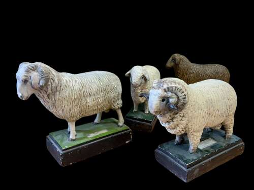 A MID CENTURY COLLECTION OF PLASTER SHEEP MODELS